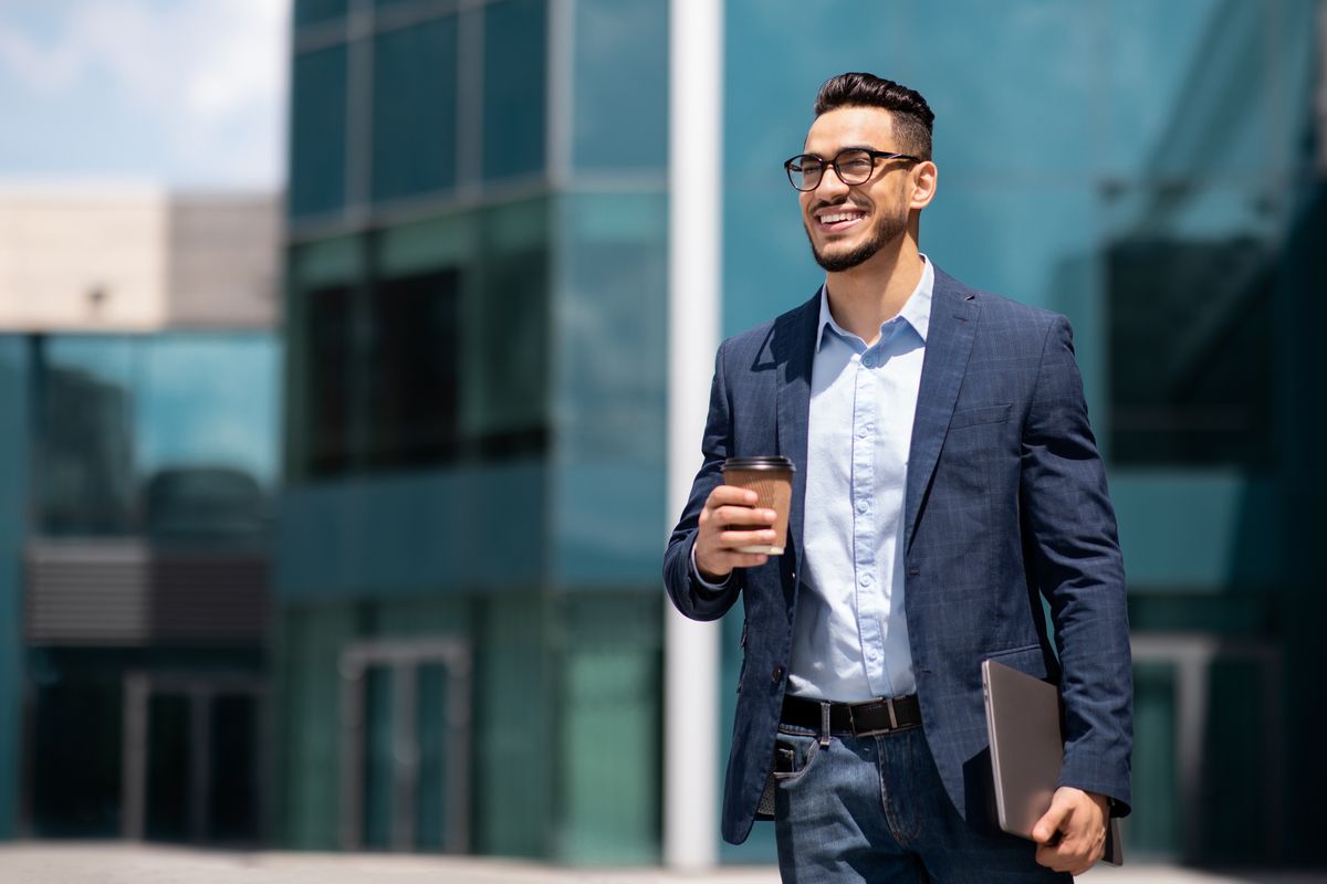 Business professional reviewing curated industry intelligence
